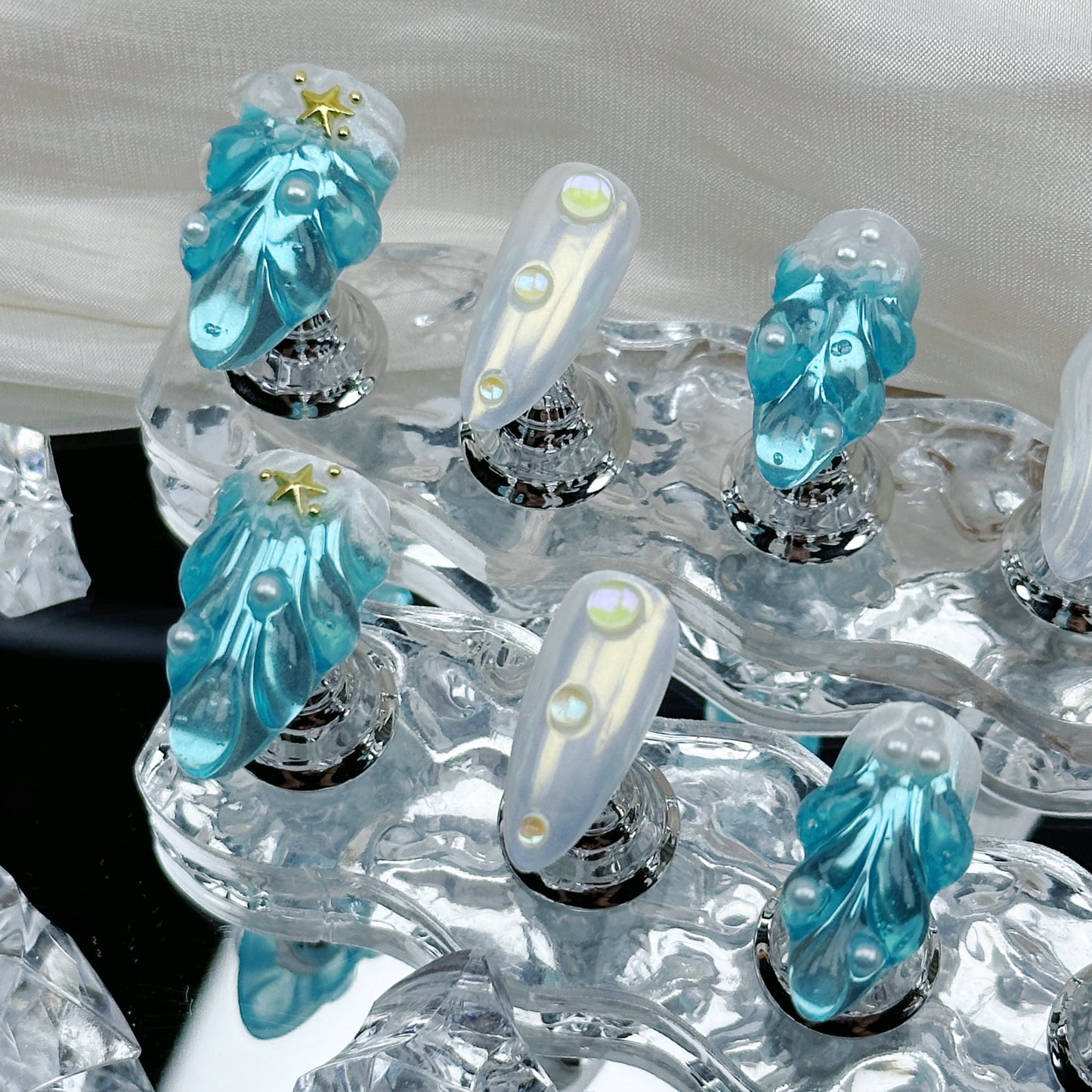 Frozen Pearl | Handmade Press-On Nails | Style No. A028 | 3D Blue Sculpted Charms, Iridescent White Shell Finish, Reusable Nail Set