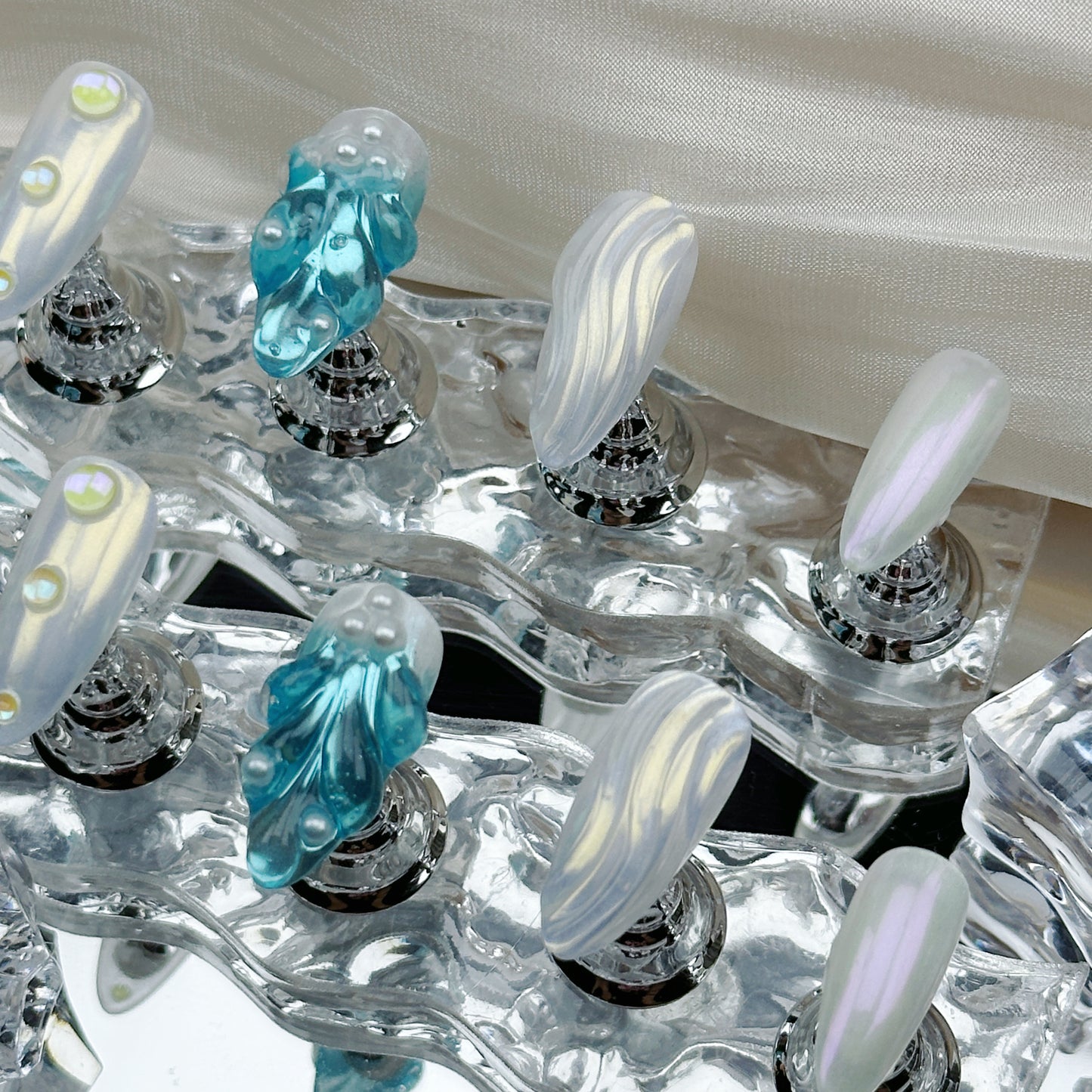 Frozen Pearl | Handmade Press-On Nails | Style No. A028 | 3D Blue Sculpted Charms, Iridescent White Shell Finish, Reusable Nail Set