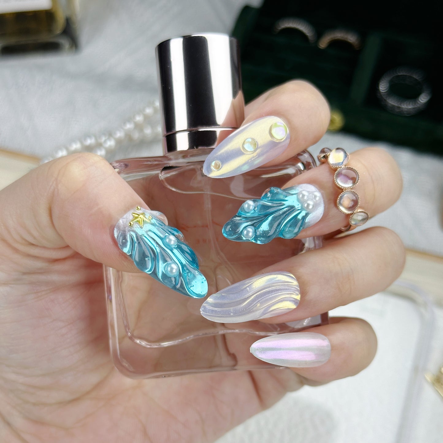 Frozen Pearl | Handmade Press-On Nails | Style No. A028 | 3D Blue Sculpted Charms, Iridescent White Shell Finish, Reusable Nail Set