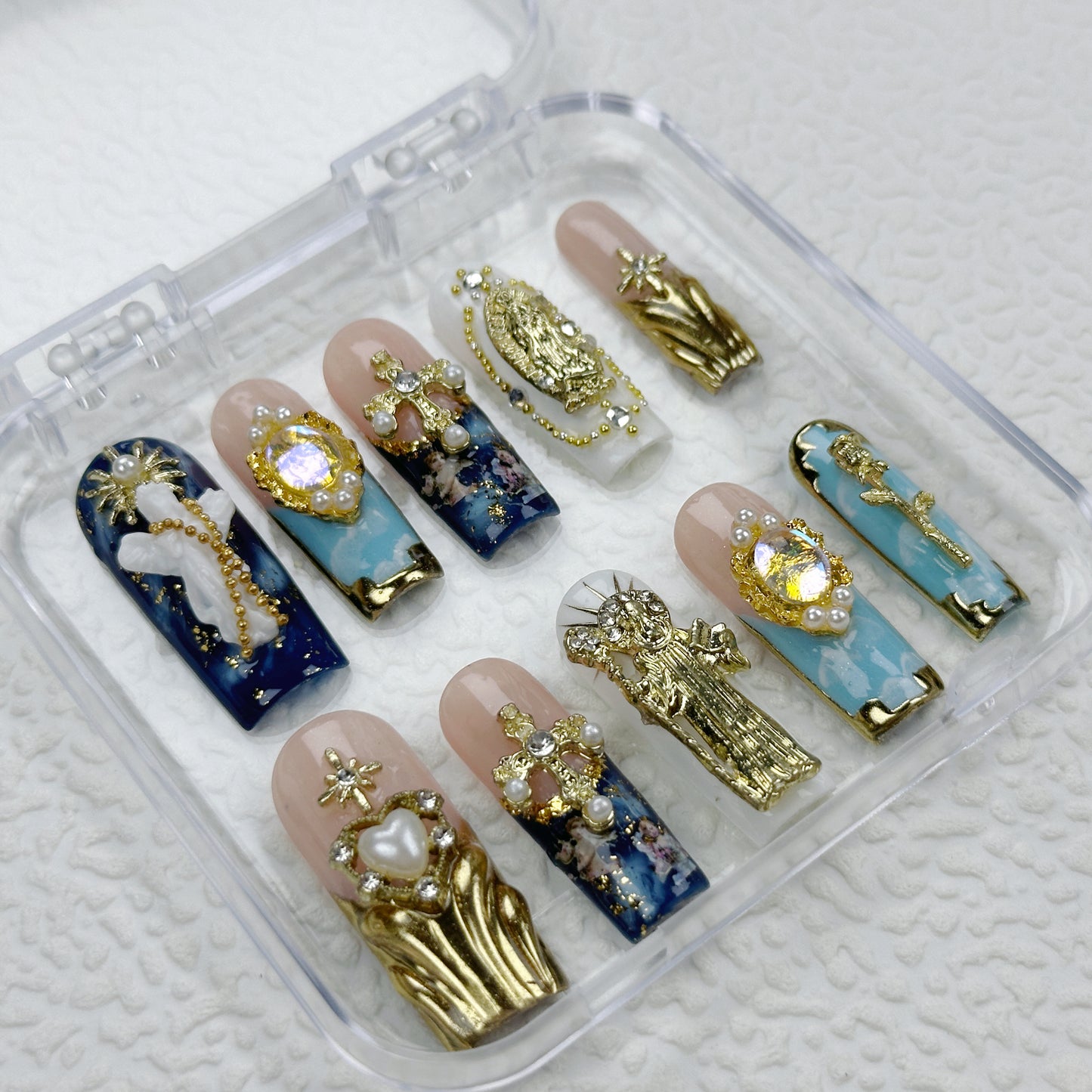Divine Icons | Handmade Press-On Nails | Style No. A039| Gold Religious Charms, Marble Blue Base & Cross Embellishments, Reusable Statement Nail Set
