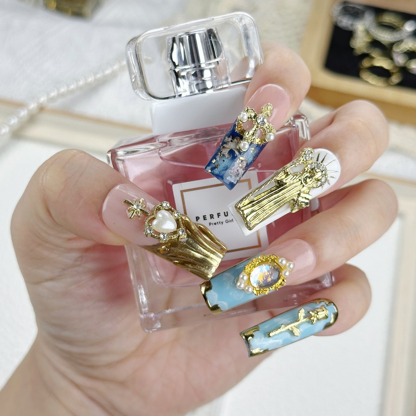 Divine Icons | Handmade Press-On Nails | Style No. A039| Gold Religious Charms, Marble Blue Base & Cross Embellishments, Reusable Statement Nail Set